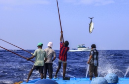 A group of fishermen aboard a boat.
