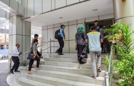 A file photo showing civil servants entering Velaanaage office complex. PHOTO: NISHAN ALI/ MIHAARU