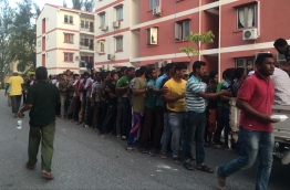 Expatriates queue for Iftar food near a mosque in Hulhumale'. PHOTO: NIUMATHULLA IDHUREES/ MIHAARU