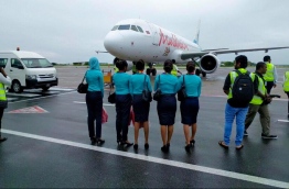 Cabin crew members pictured in front of a Maldivian aircraft. PHOTO/MIHAARU