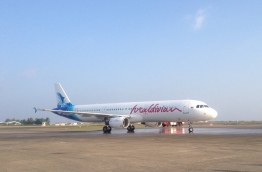 A Maldivian Airline aircraft at the Velana International Airport (VIA) tarmac--