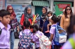 Young children flock to school at the beginning of the academic new year in 2017. Parents stop by to have a word with teachers and click a customary 'back to school' snap. PHOTO: NISHAN ALI / MIHAARU