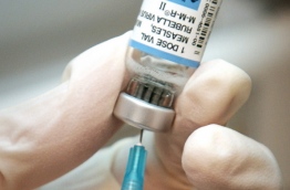 A nurse draws a dose of mumps-measles-rubella, or MMR, vaccine. Photo: AP Photo/The Witchita Eagle, Mike Hutmacher