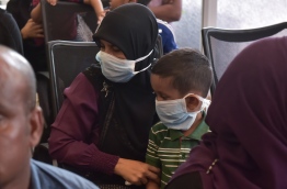 People wear surgical masks in the temporary flu clinic opened in IGMH amidst the swine flu outbreak in Male in March 2017.