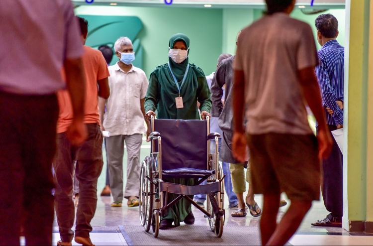 ސްވައިން ފްލޫ ޖެހުނު އަންހެން މީހާގެ ދަރިފުޅު ބޭރަށް