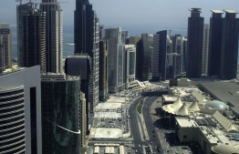 (FILES) This file photo taken on October 4, 2012 shows skyscrapers in the Qatari capital Doha. PHOTO: PATRICK BAZ / AFP