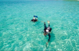 Tourists venture out on a diving excursion at a resort in Maldives. PHOTO: MIHAARU