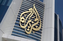 The logo of Al Jazeera Media Network is seen on its headquarters building in Doha, Qatar June 8, 2017. PHOTO: NASEEM ZEITOON / REUTERS