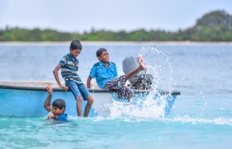 Young boys enjoying their day on a dinghy in Fainu, Raa Atoll. PHOTO: HUSSAIN WAHEED/ MIHAARU