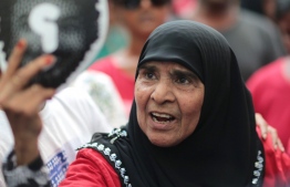 Disappeared journalist Ahmed RIlwan's mother during the 2018 'Suvaalu March'. PHOTO: SHAARI / THINVANA LOA