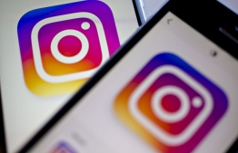 The Instagram logo is displayed on the Instagram application, PHOTO: ANDREW HARRER / BLOOMBERG / GETTY IMAGES