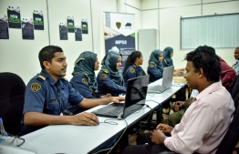 People pictured at Maldives Immigration service counters. FILE PHOTO/MIHAARU