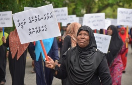 Resort workers holding signboards at a protest. According to UNDP, over 45,000 resort employees in Maldives were directly affected by the COVID-19 pandemic. PHOTO: HUSSAIN WAHEED/ MIHAARU
