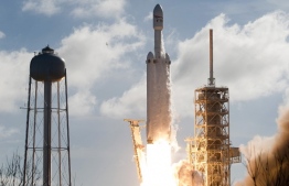 The SpaceX Falcon Heavy launches from Pad 39A at the Kennedy Space Center in Florida, on February 6, 2018, on its demonstration mission.
The world's most powerful rocket, SpaceX's Falcon Heavy, blasted off Tuesday on its highly anticipated maiden test flight, carrying CEO Elon Musk's cherry red Tesla roadster to an orbit near Mars. Screams and cheers erupted at Cape Canaveral, Florida as the massive rocket fired its 27 engines and rumbled into the blue sky over the same NASA launchpad that served as a base for the US missions to Moon four decades ago.
 / AFP PHOTO / JIM WATSON