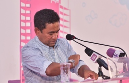 President Yameen glances at his watch, during a PPM Rally. PHOTO: MIHAARU
