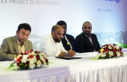 SeaLife Global's MD Ahmed Moosa Mohamed (L-2) signs the Hulhumale' housing project agreement. FILE PHOTO/MIHAARU