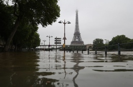 The river Seine bursting its banks next to the Eiffel Tower in Paris on June 2, 2016