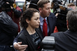 Former Chelsea Football Club doctor Eva Carneiro (C) leaves Croydon Employment Tribunal in Croydon, south London, on June 7, 2016 after a private settlement was reached in her claim against Chelsea footabll club and former manager Jose Mourinho./ AFP PHOTO