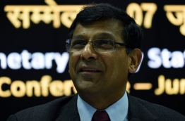 In this photograph taken on June 7, 2016, India's central bank - Reserve Bank of India (RBI) governor Raghuram Rajan reacts during a press conference following a monetary policy review meeting in Mumbai./ AFP PHOTO