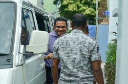 Former defence minister Mohamed Nazim smiles as he is led inside the Supreme Court for the hearing on June 15, 2016. MIHAARU PHOTO/NISHAN ALI