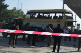 A suicide bomber hit a minibus carrying foreign security guards and caused several casualties early on June 20 in Kabul along the main road to the eastern city of Jalalabad, police said. The attacker was on foot, according to police, who refused to give a toll but said there were "multiple casualties" among the bus passengers who were "employees of a foreign compound".The bus was carrying Nepalese guards, according to an AFP cameraman, who also reported more than two dozen ambulances at the scene. / AFP PHOTO / SHAH MARAI