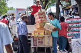 A man unloads goods at the local market in the capital Male. MIHAARU PHOTO
