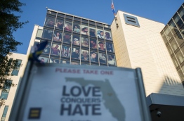 Victims of the Orlando mass shooting are seen on the side of the Human Rights Campaign building in Washington, DC on June 17, 2016. / AFP PHOTO / Andrew CABALLERO-REYNOLDS