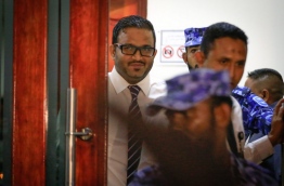 Former vice president Adheeb being escorted out of the criminal court after he was convicted and sentenced to 15 years in prison for orchestrating the blast aboard the presidential speedboat now confirmed as a plot to assassinate the president. MIHAARU PHOTO/MOHAMED SHARUHAAN