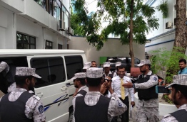 Jailed former president Nasheed being escorted by correctional service officer. PHOTO/AHMED AZIM