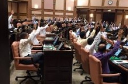 Lawmakers raise their hands in support of extending the parliament sitting on Wednesday. PHOTO/PARLIAMENT SECRETARIAT