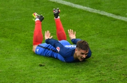 France's forward Antoine Griezmann celebrates after scoring his team's fourth goal during the Euro 2016 quarter-final football match between France and Iceland at the Stade de France in Saint-Denis, near Paris, on July 3, 2016. Francisco LEONG / AFP