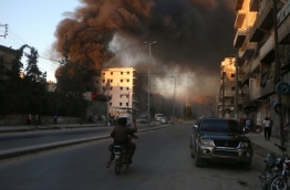 The Syrian Observatory for Human Rights said fresh government air strikes on rebel-held Aleppo killed four civilians on July 9, adding that opposition fighters had renewed rocket fire on government-held districts. The local civil defence unit said one of its centres had been targeted and two volunteers killed in the government air strikes. / AFP PHOTO / FADI AL-HALABI