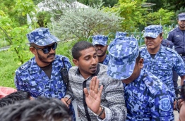 Police block an opposition lawmaker from holding a press conference in a restricted area. MIHAARU FILE PHOTO