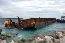 The barge had begun to keel following the breach and was unloaded at the Industrial Village with an excavator on Tuesday.