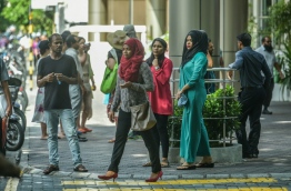 Some civil servants pictured outside the main government office building ‘Velaanaage’ in the capital Male. MIHAARU PHOTO/NISHAN ALI