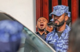 MP Mahloof reacts as he is led away by police after the criminal court sentenced him to four months in jail on Monday. MIHAARU PHOTO/MOHAMED SHARUHAAN