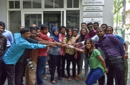 Some journalists join hands to show solidarity during a recent protest against the closure of a local online newspaper. MIHAARU FILE PHOTO