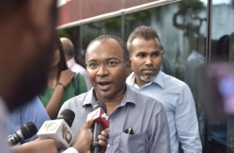 Hassan Latheef speaking to reporters after giving his statement to the police on Saturday. MIHAARU PHOTO/MOHAMED SHARUHAAN