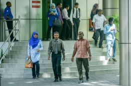 People pictured at the entrance to the main government office complex 'Velaanaage'. MIHAARU FILE PHOTO/NISHAN ALI