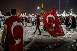 Hundreds of thousands of people gathered in Istanbul for a pro-democracy rally organised by the ruling party, bringing to an end three weeks of demonstrations in support of President Recep Tayyip Erdogan after last month's failed coup. / AFP PHOTO / OZAN KOSE