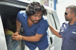The 24-year-old Sri Lankan national, Lahiru Madhushanka being escorted to the criminal court on Wednesday. MIHAARU PHOTO/MOHAMED SHARUHAAN