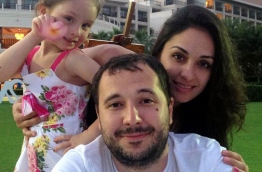 Alleged Russian hacker Roman Seleznev pictured with his girlfriend and daughter.