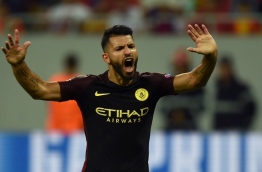 Manchester City's Argentinian striker Sergio Aguero celebrates scoring a goal during the UEFA Champions league first leg play-off football match between Steaua Bucharest and Manchester City at the National Arena stadium in Bucharest on August 16, 2016. / AFP PHOTO / DANIEL MIHAILESCU
