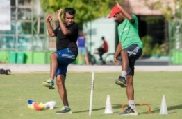 Marzooq trains with a national cricket team player. PHOTO/IBRAHIM FAID