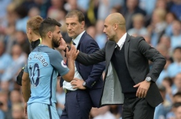 Manchester City's Spanish manager Pep Guardiola (R) greets Manchester City's Argentinian striker Sergio Aguero after he was substituted during the English Premier League football match between Manchester City and West Ham United at the Etihad Stadium in Manchester, north west England, on August 28, 2016. / AFP PHOTO / OLI SCARFF 