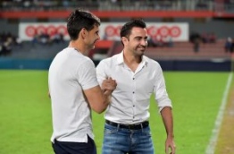 Ayala and Xavi pictured before kickoff of the exhibition match between the Maldives' 2008 championship winning team and the current national team at the Maldives National Football Stadium on August 29, 2016. MIHAARU PHOTO/NISHAN ALI