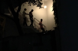 Police officers pictured inside Nasheed's house in the capital Male on Wednesday.