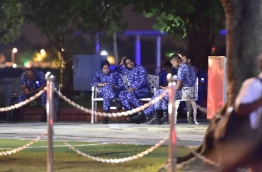 Some police officers taking a break during a opposition protest held in the capital Male late last month. MIHAARU FILE PHOTO/MOHAMED SHARUHAAN