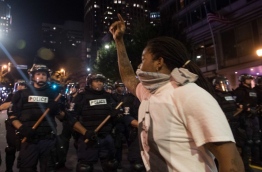 A protester in Charlotte, North Carolina was fatally shot by a civilian during a second night of unrest after the police killed a black man, officials said. / AFP PHOTO / NICHOLAS KAMM