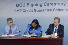 Maldives Monetary Authority (MMA)'s governor (M) and the CEOs of BML (R) and MIB sign the MOU to participate in the SME Credit Guarantee Scheme last month. PHOTO: NISHAN ALI/MIHAARU